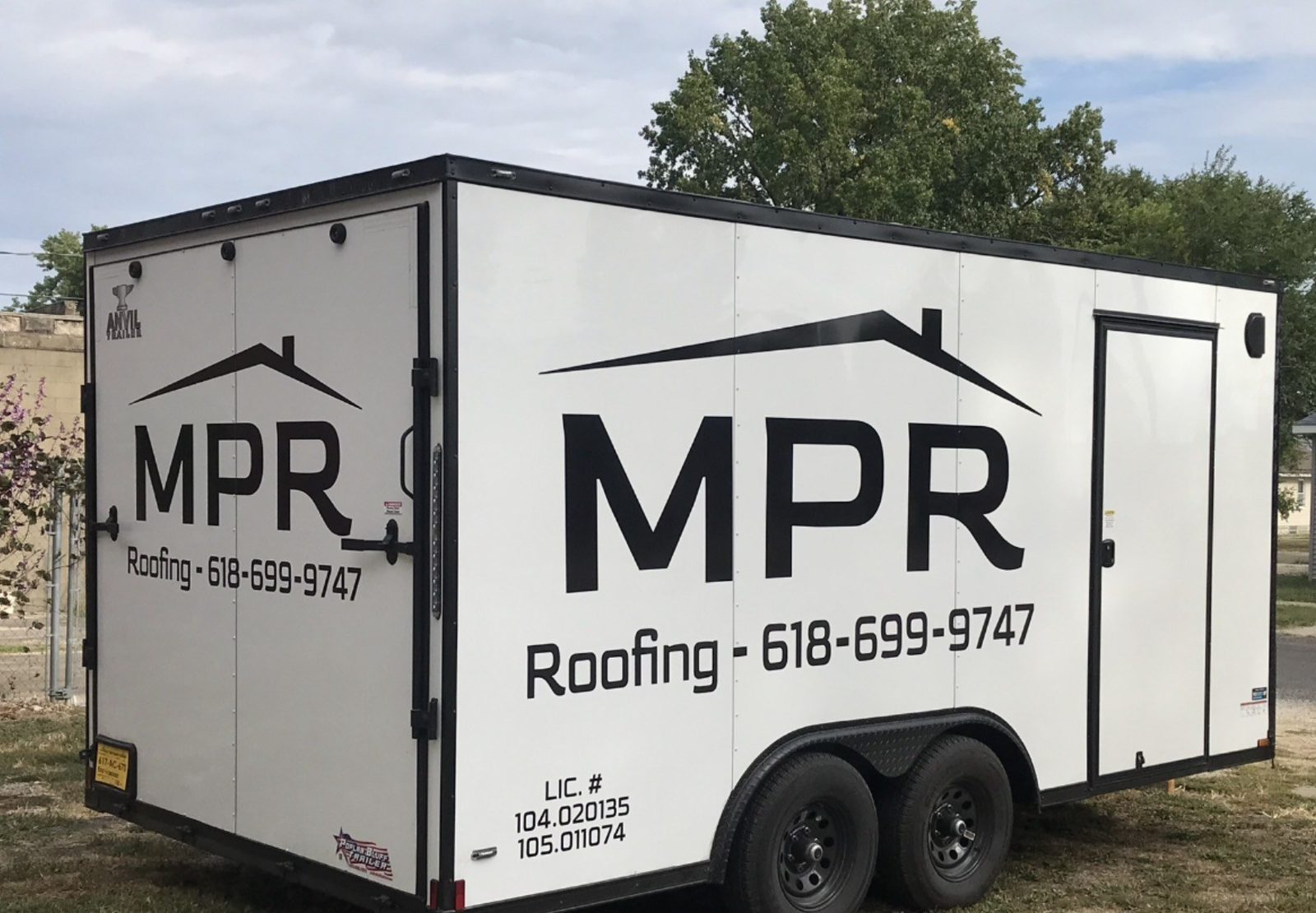MPR Roofing enclosed work trailer with logo, phone number, and Illinois roofing license numbers